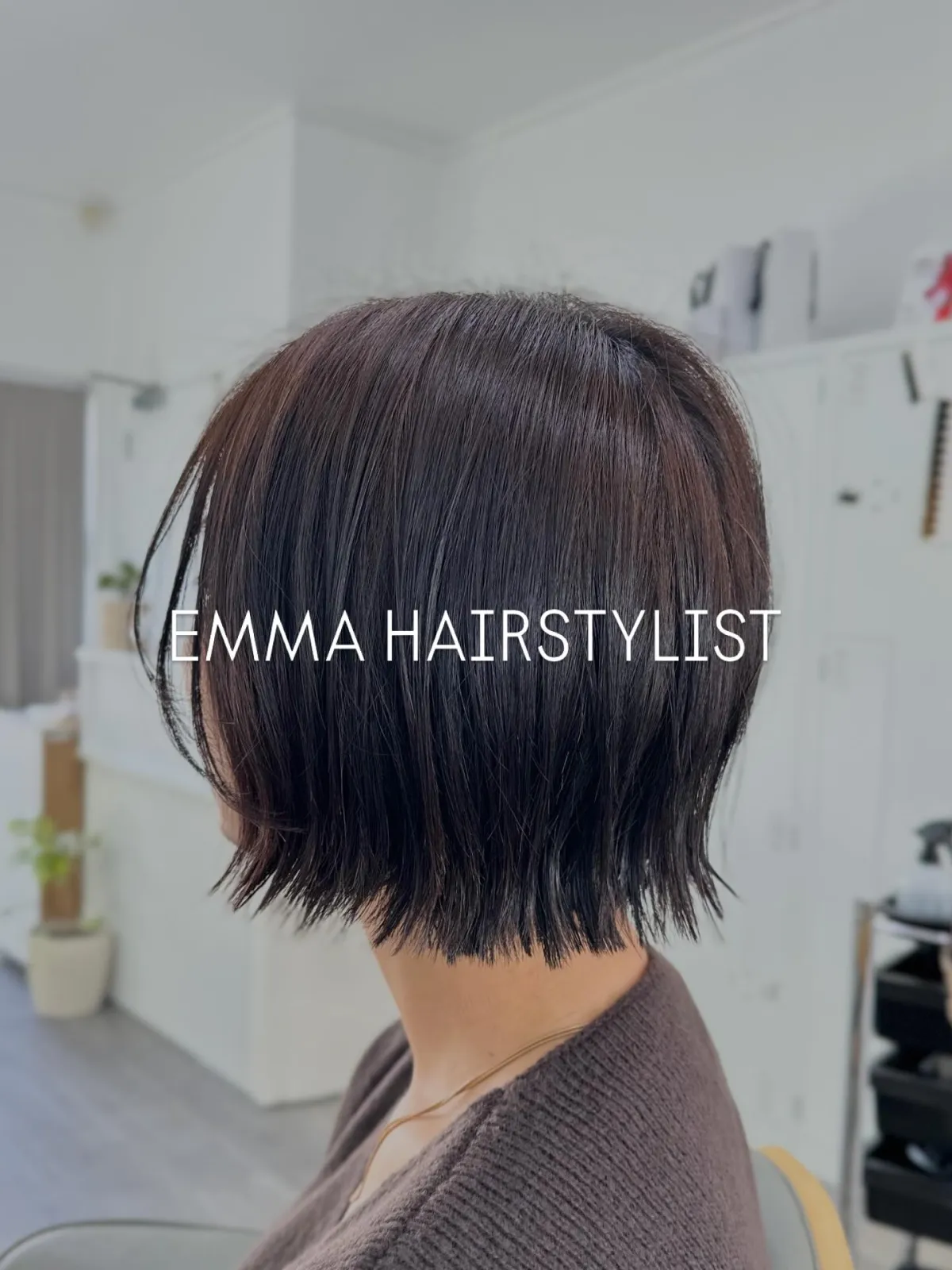 A sleek dark chin-length bob with lightly textured ends, cut and styled at Emma Hair Stylist
