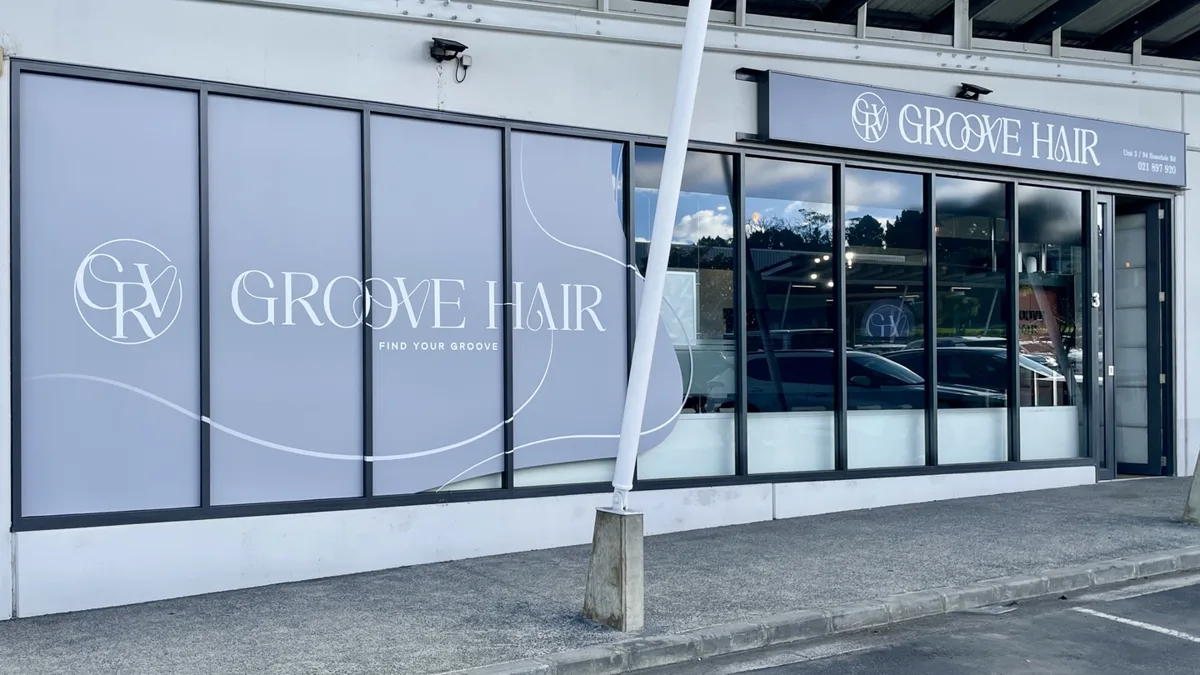 The Groove Hair shopfront on Rosedale Road, with the salon name across the window graphic and fascia sign